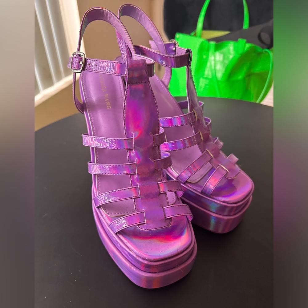 Brand new purple holographic sandal platforms. Size 10 by “Azalea Wang”